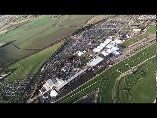 James Kenwright flying a helicopter over Cheltenham Racecourse during the November 2017 meeting.